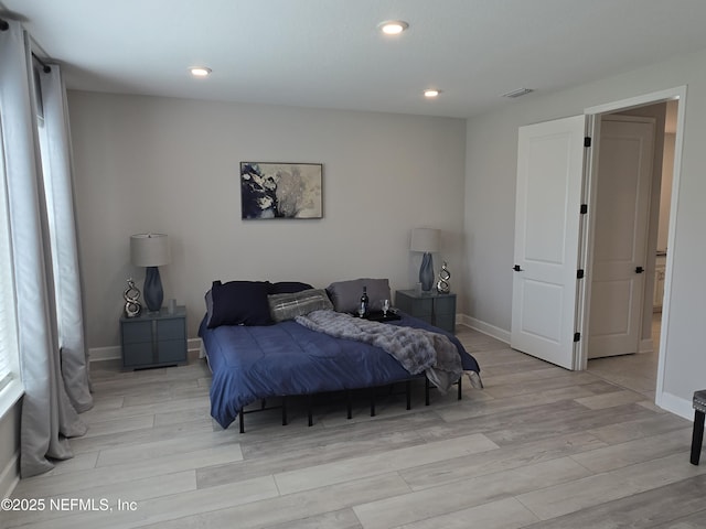 bedroom featuring recessed lighting, light wood-style floors, visible vents, and baseboards