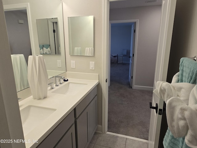 full bath with tile patterned flooring, visible vents, double vanity, and a sink