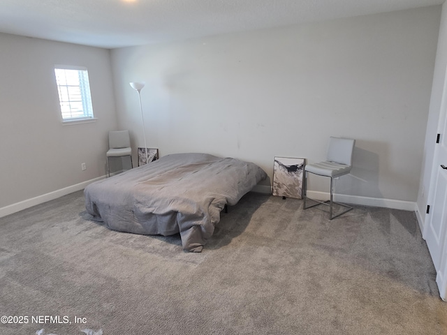 carpeted bedroom with baseboards