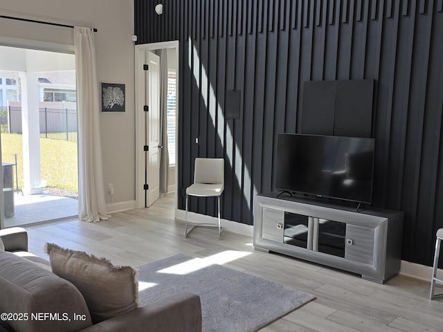 living room featuring wood finished floors and baseboards