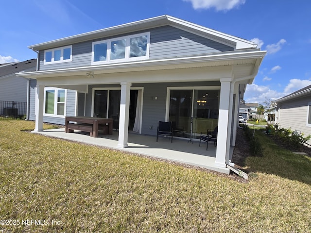 back of property featuring a lawn, central air condition unit, and a patio