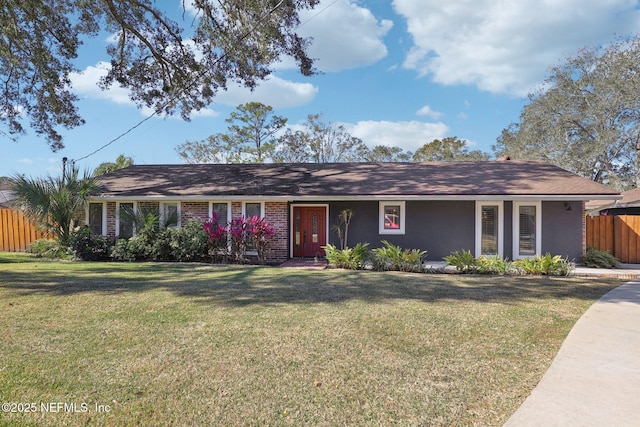 ranch-style house featuring a front lawn