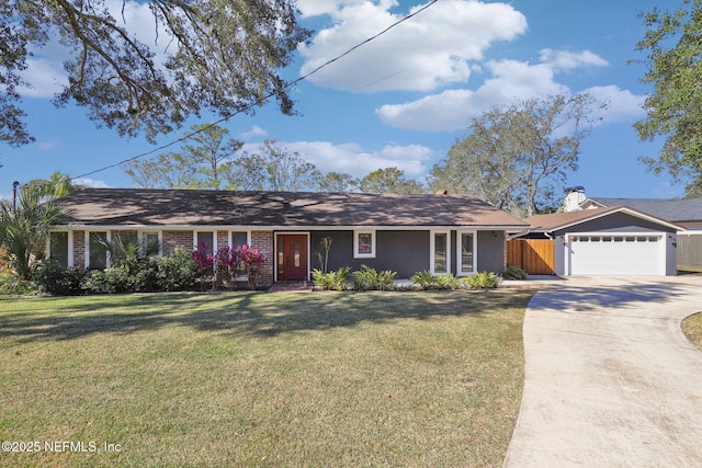 ranch-style home featuring a garage and a front yard