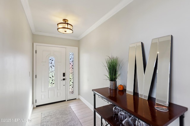 entryway with ornamental molding and light wood-type flooring