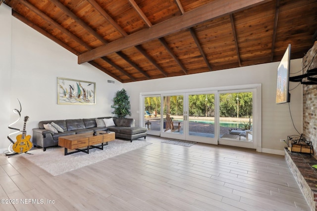 living room with wood ceiling, beam ceiling, high vaulted ceiling, and french doors