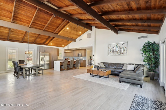 living room with wooden ceiling, light hardwood / wood-style floors, and beamed ceiling