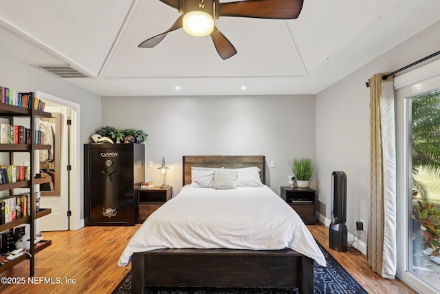 bedroom with access to outside, ceiling fan, and light hardwood / wood-style floors