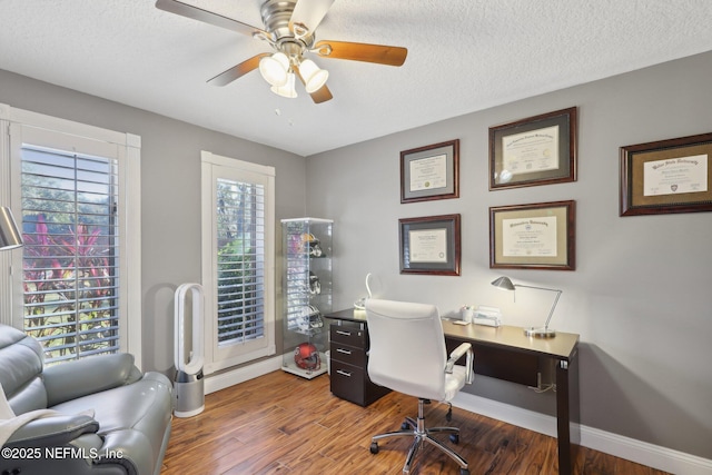 office with a textured ceiling, wood-type flooring, and ceiling fan