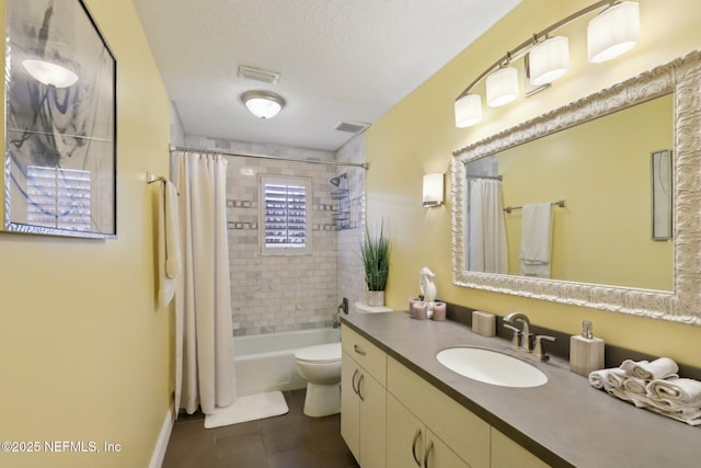 full bathroom featuring toilet, shower / tub combo, a textured ceiling, vanity, and tile patterned flooring