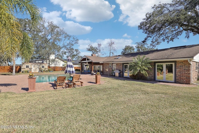 view of yard with a patio area and french doors