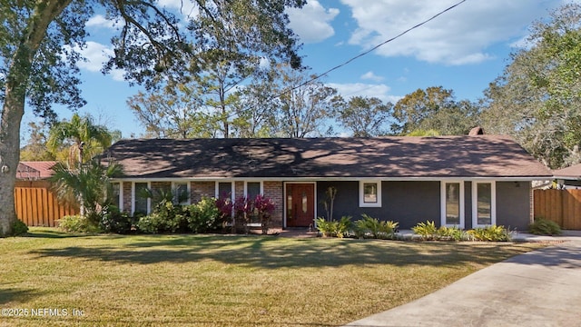 ranch-style house featuring a front lawn