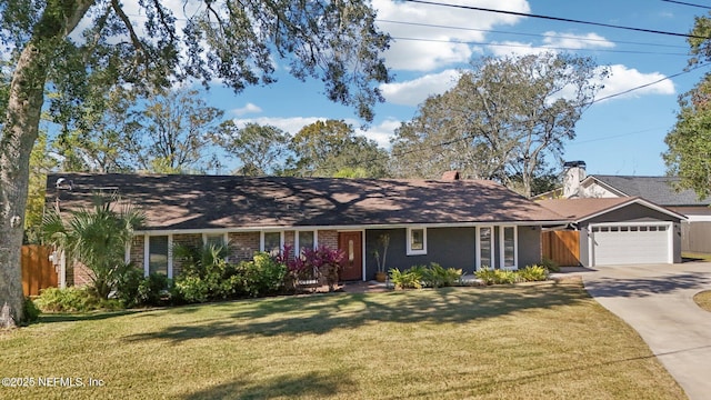 ranch-style house featuring a garage and a front lawn