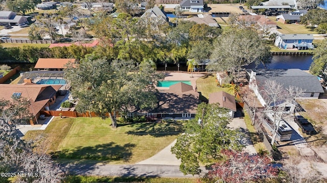 birds eye view of property with a water view