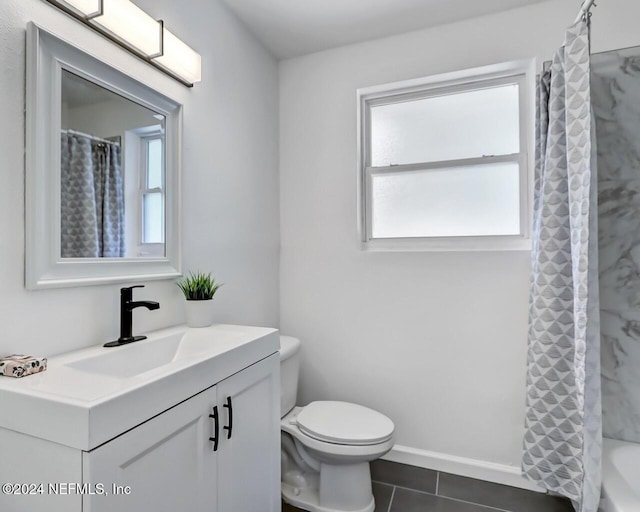 full bathroom featuring tile patterned flooring, vanity, toilet, and shower / tub combo with curtain