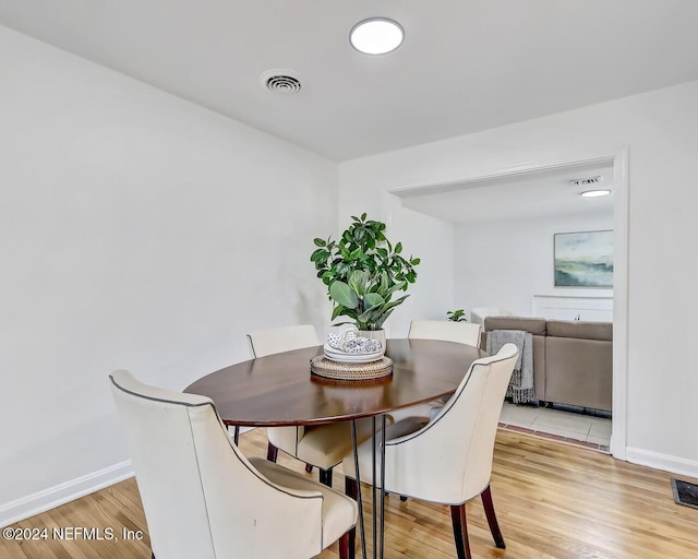 dining room featuring light hardwood / wood-style floors