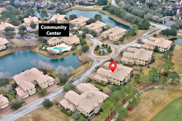 birds eye view of property featuring a water view