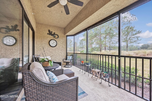 sunroom with vaulted ceiling and ceiling fan