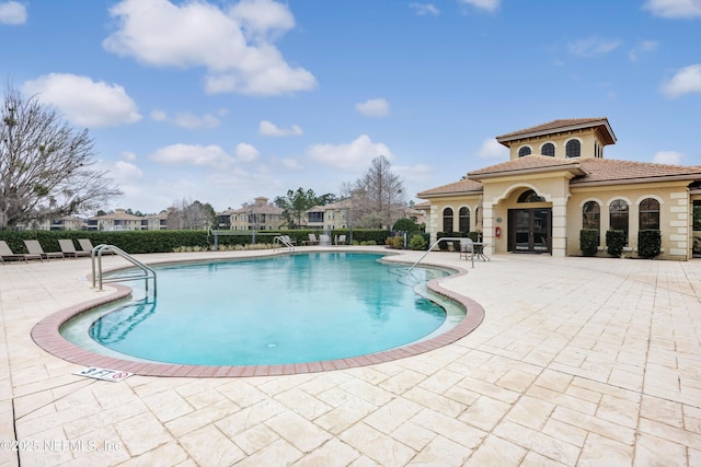 view of pool featuring a patio