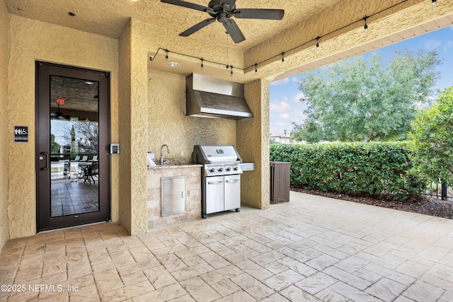 view of patio / terrace featuring ceiling fan, an outdoor kitchen, sink, and area for grilling