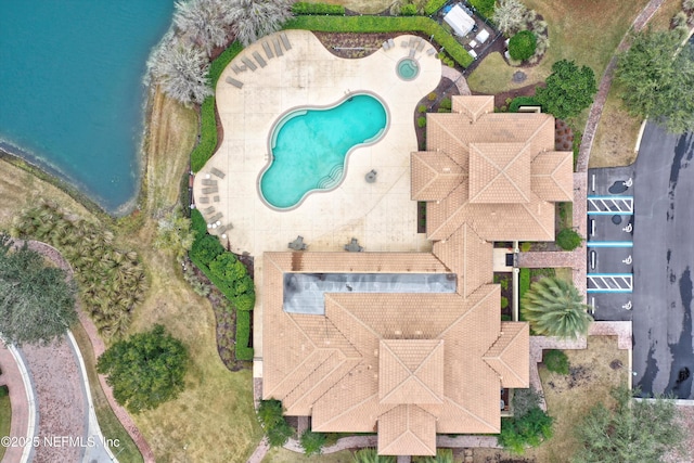 birds eye view of property with a water view