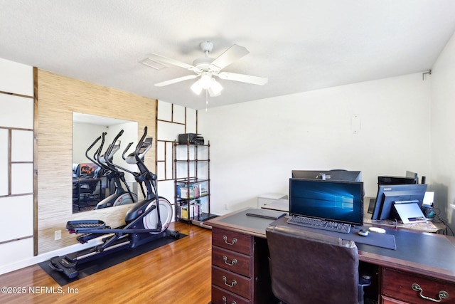 office space with ceiling fan and wood finished floors