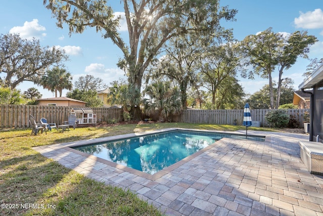 view of swimming pool with a patio area, a fenced backyard, and a fenced in pool