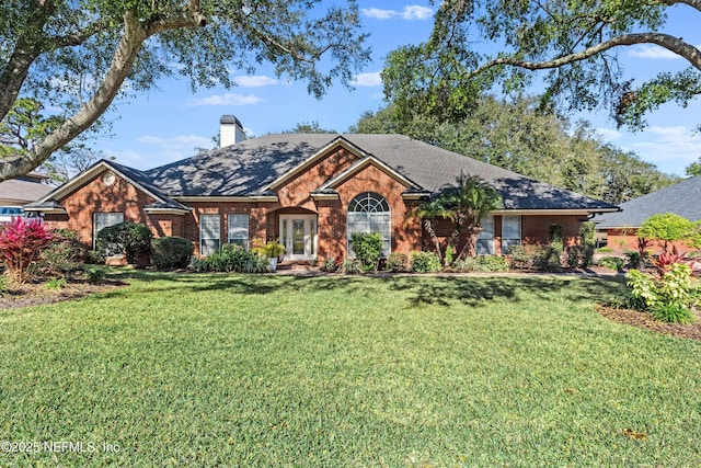 ranch-style house featuring a front yard