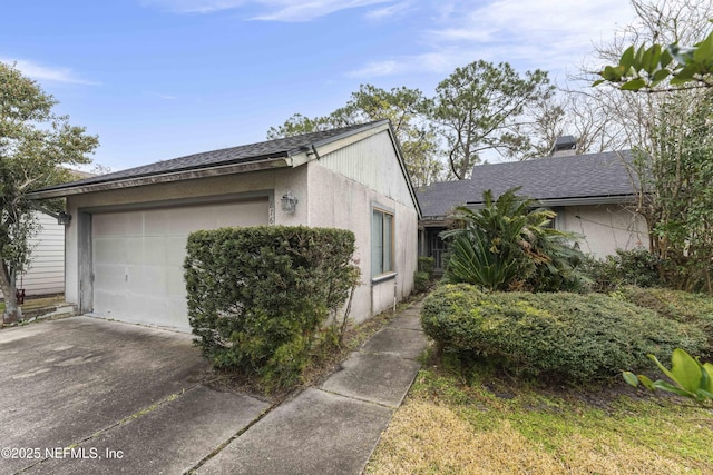 view of side of property with a garage