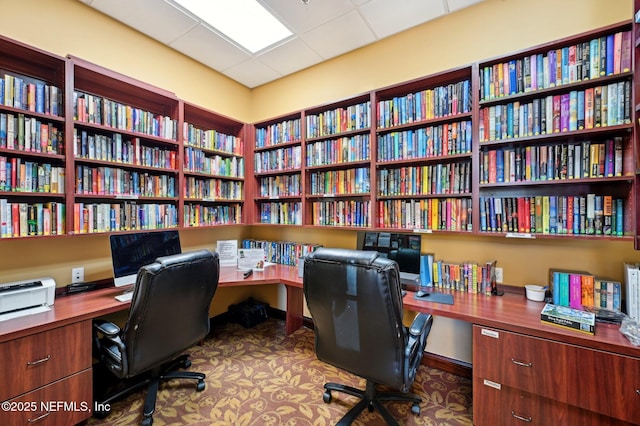 office with a paneled ceiling