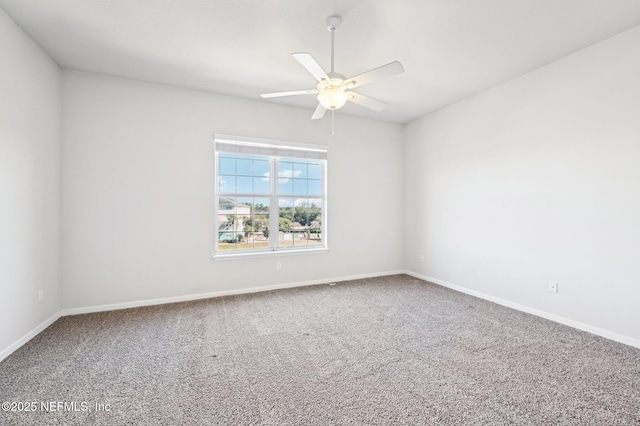 unfurnished room with carpet and ceiling fan