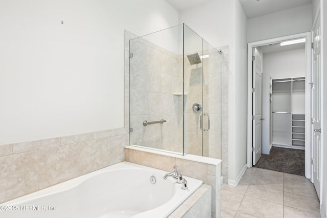 bathroom featuring separate shower and tub and tile patterned floors