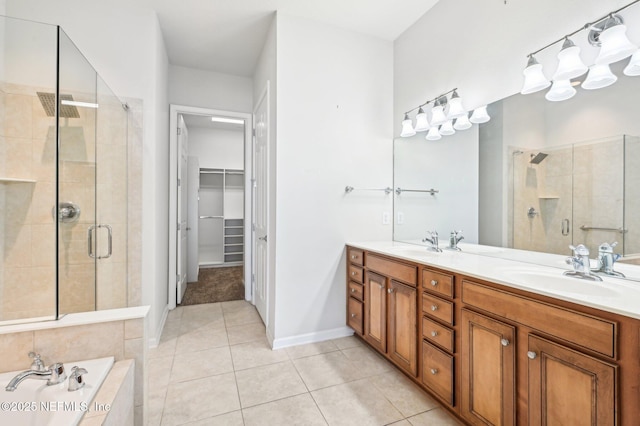 bathroom with independent shower and bath, vanity, and tile patterned floors