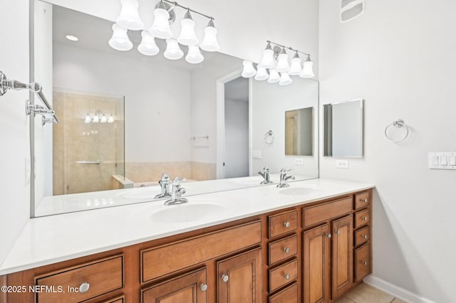 bathroom featuring vanity, tile patterned floors, and a shower with shower door