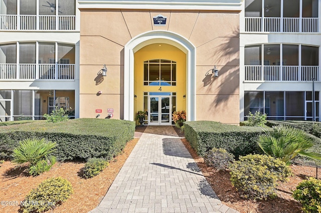 property entrance featuring french doors