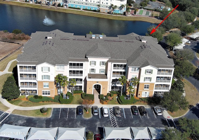 birds eye view of property featuring a water view