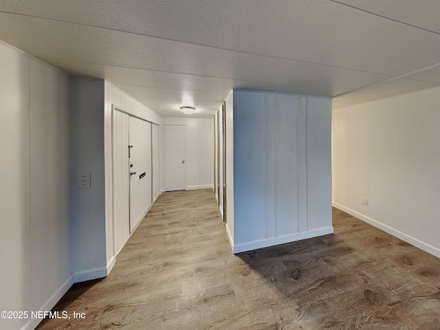 hall with light hardwood / wood-style floors