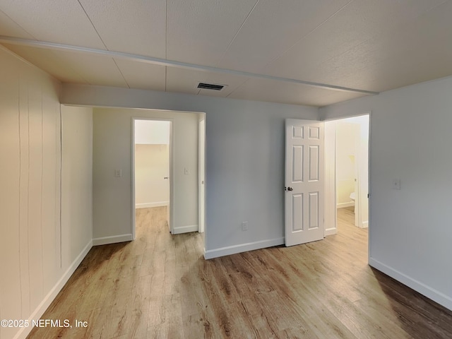 unfurnished room featuring light wood-type flooring