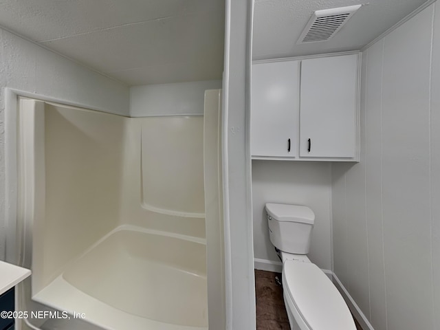 full bathroom featuring toilet, shower with separate bathtub, a textured ceiling, vanity, and hardwood / wood-style flooring