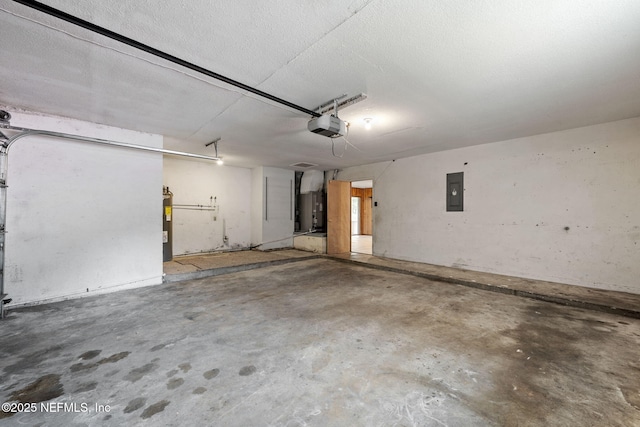 garage with a garage door opener, electric panel, and gas water heater