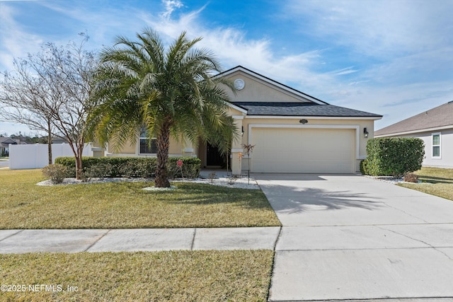 view of front of house with a garage and a front lawn