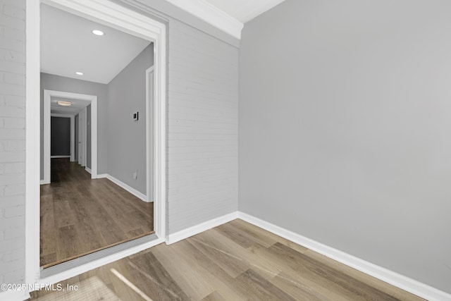 hallway with wood-type flooring