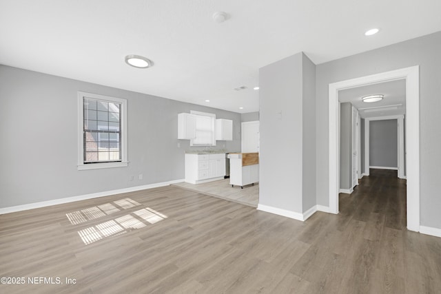 unfurnished living room featuring light wood-type flooring