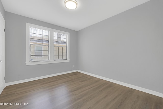 unfurnished room with hardwood / wood-style floors