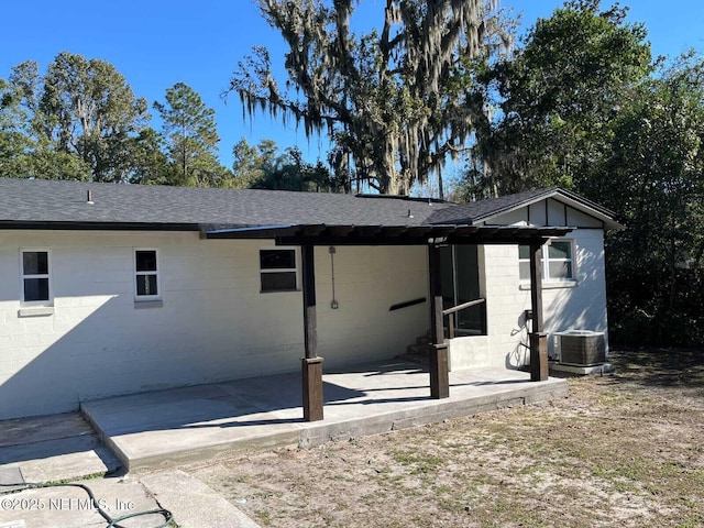 rear view of property featuring central AC and a patio