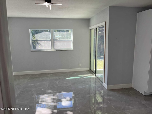 empty room with a textured ceiling