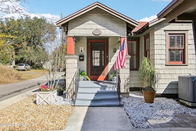 doorway to property featuring central AC unit