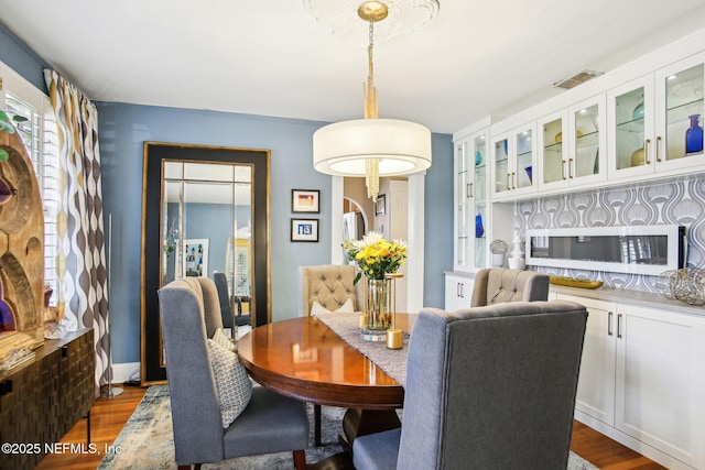 dining room featuring dark hardwood / wood-style flooring