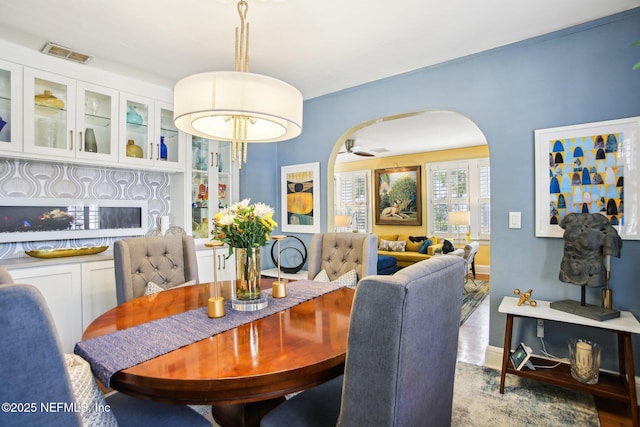 dining room featuring light hardwood / wood-style flooring and ceiling fan