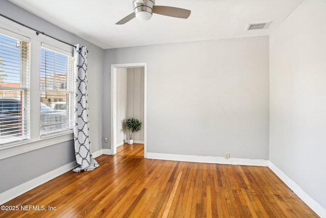 unfurnished room featuring hardwood / wood-style flooring and ceiling fan