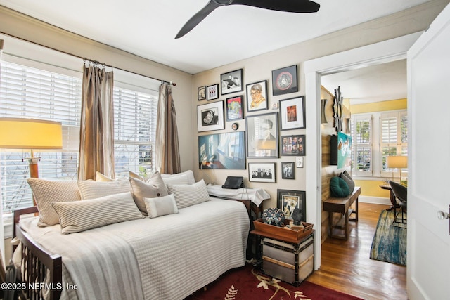 bedroom featuring ceiling fan and wood-type flooring